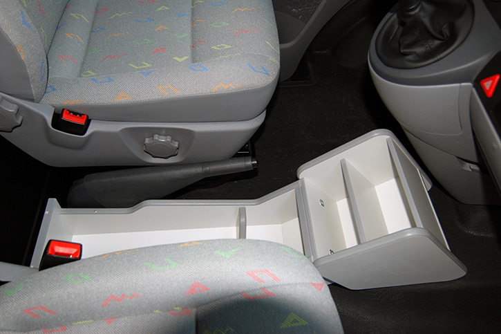 Additional storage compartments between the seats 
