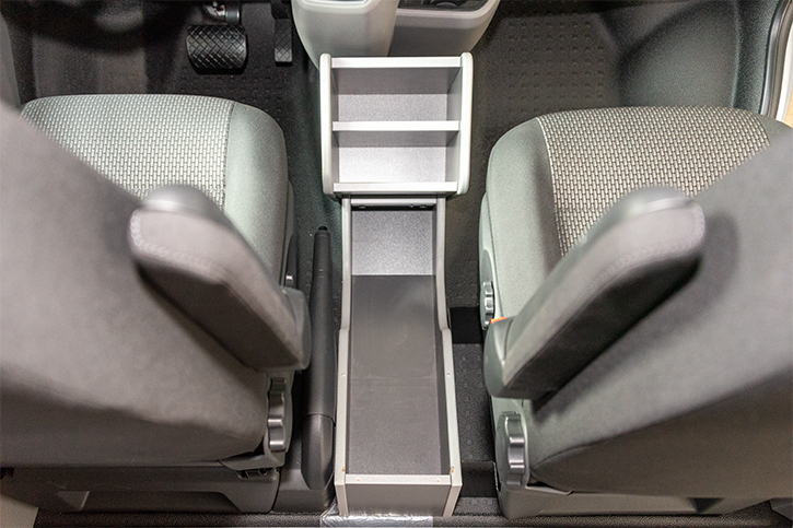Additional storage compartments between the seats 