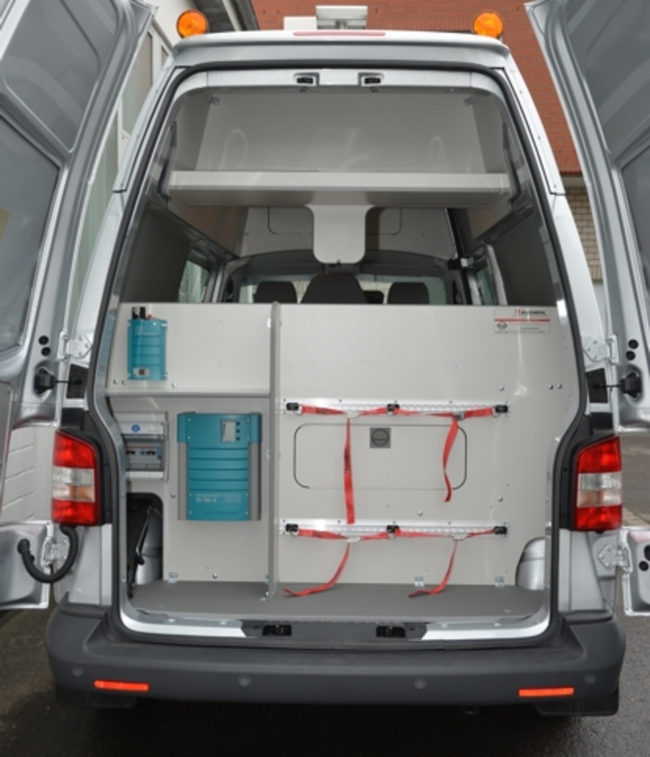 Rear interior with charger, power distribution and mountings for test gas bottles 