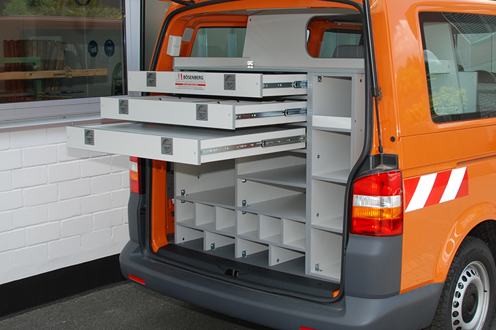 Rear interior with long compartments for tripods and ranging poles, shelves for tool boxes, pegs, boundary stones and drawers for small parts 