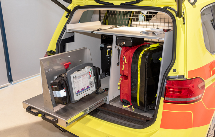Rear unit with equipment extension drawers, a compartment for an emergency backpack and various device mountings.