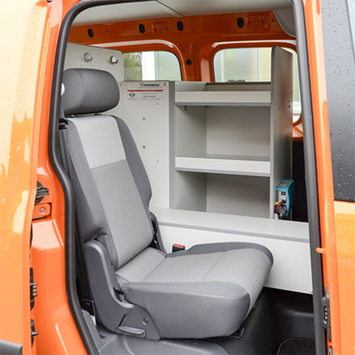 Third seat including a pull-out table 
